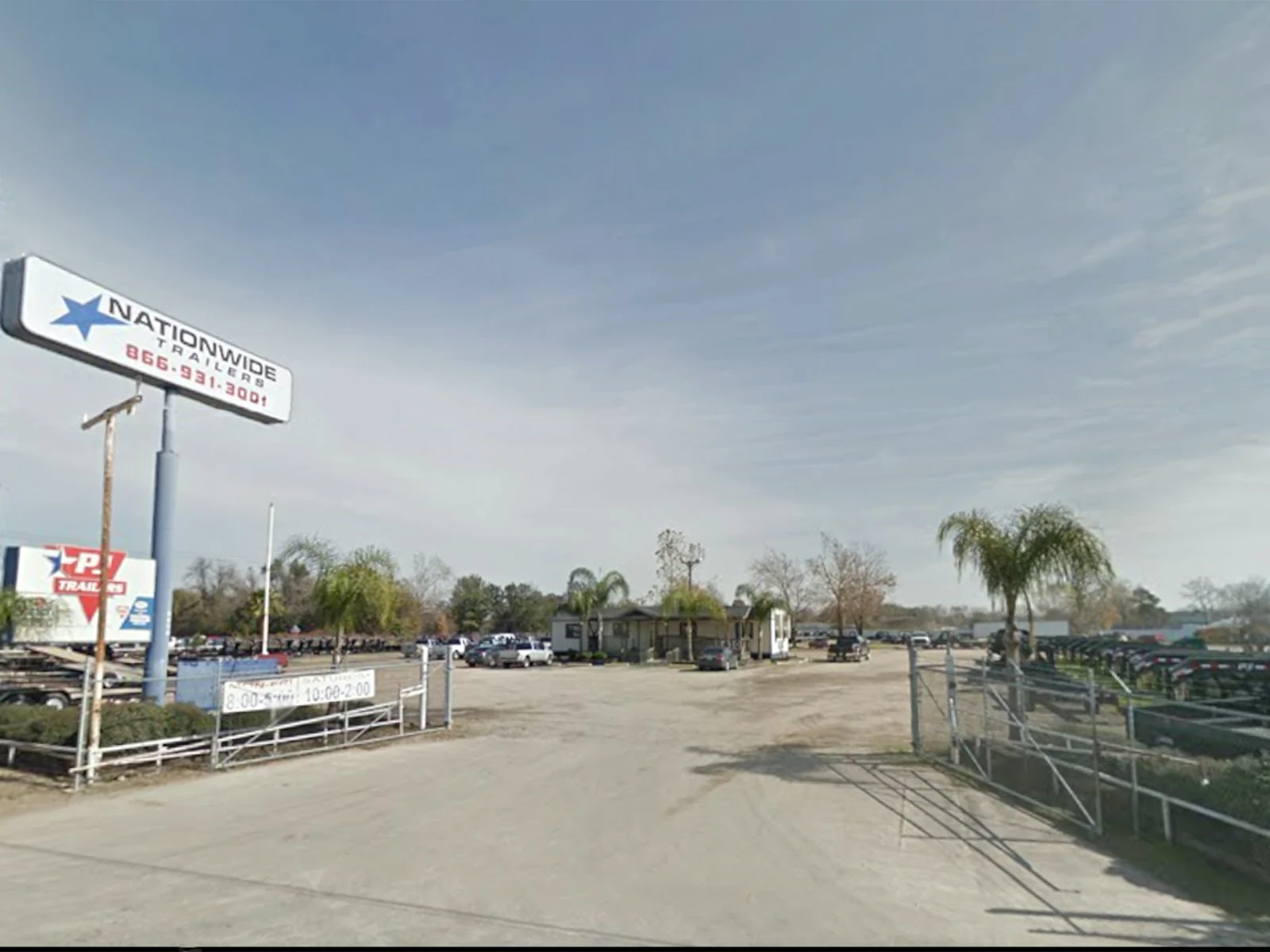 The Nationwide Trailers sign over the gravel lot off I-45, 2011
