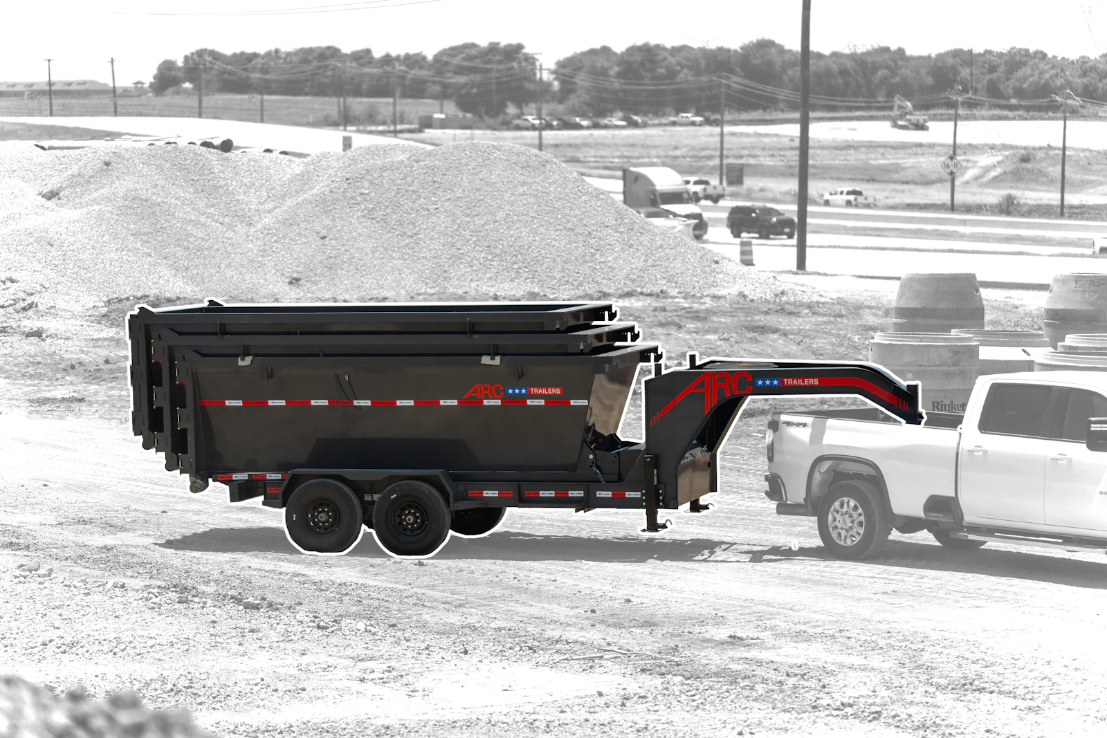 Gooseneck roll off dump trailer package with stacked bins behind a pickup