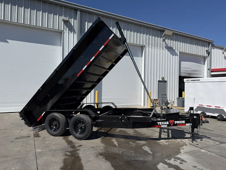 Texas Pride 14'x83" Bumper Pull Dump Trailer w/ 24" Sides, bed raised view