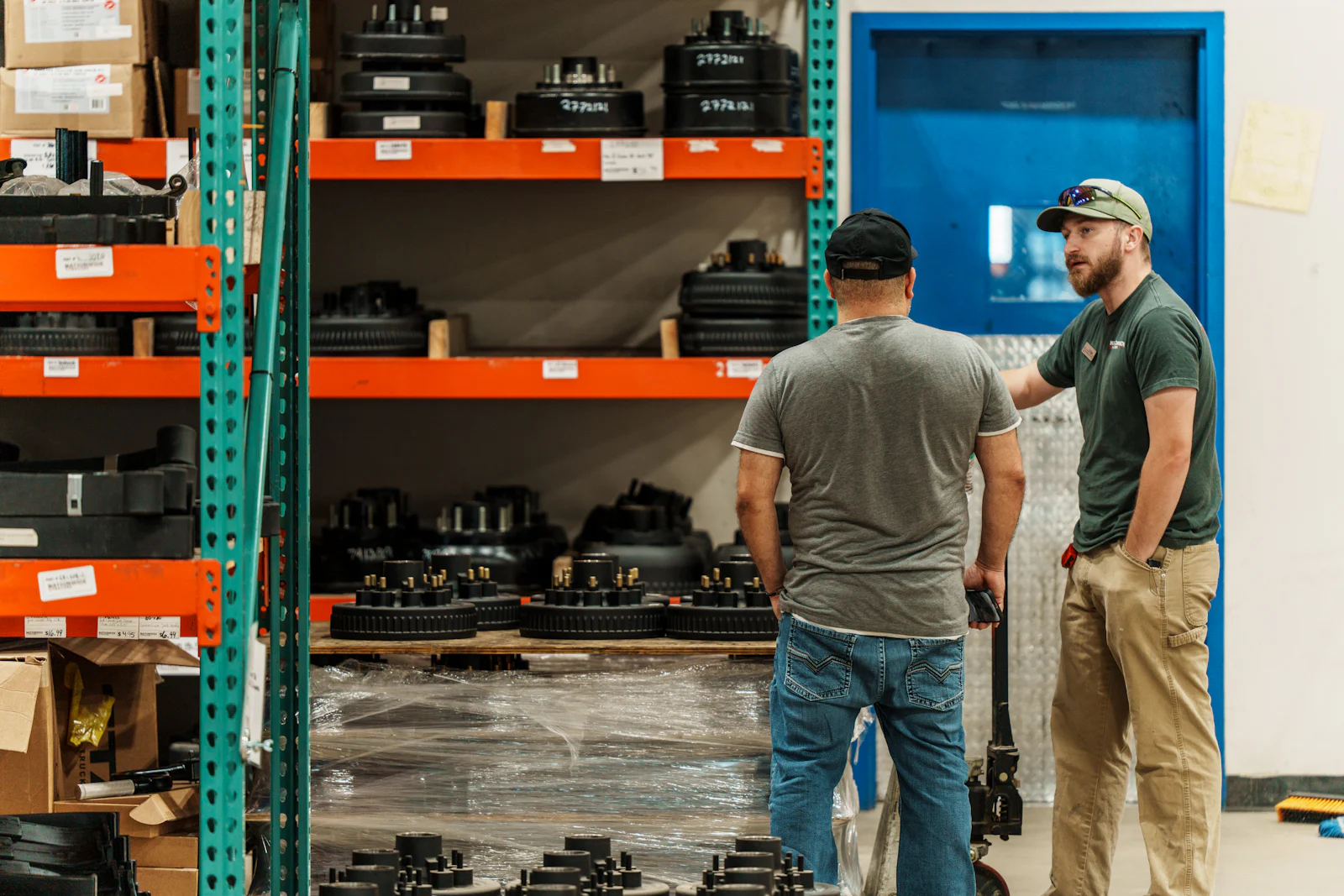 Parts team pulling hubs and brake components in the parts warehouse