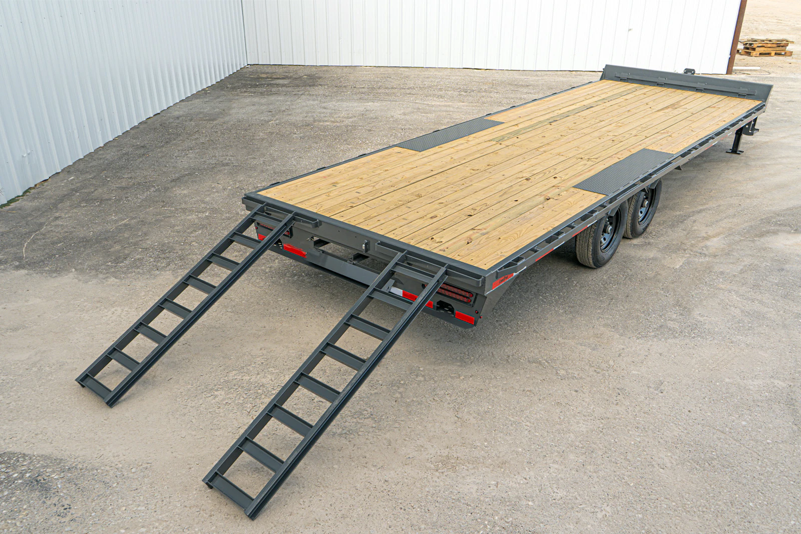 Slide-in ramps on a flatbed trailer