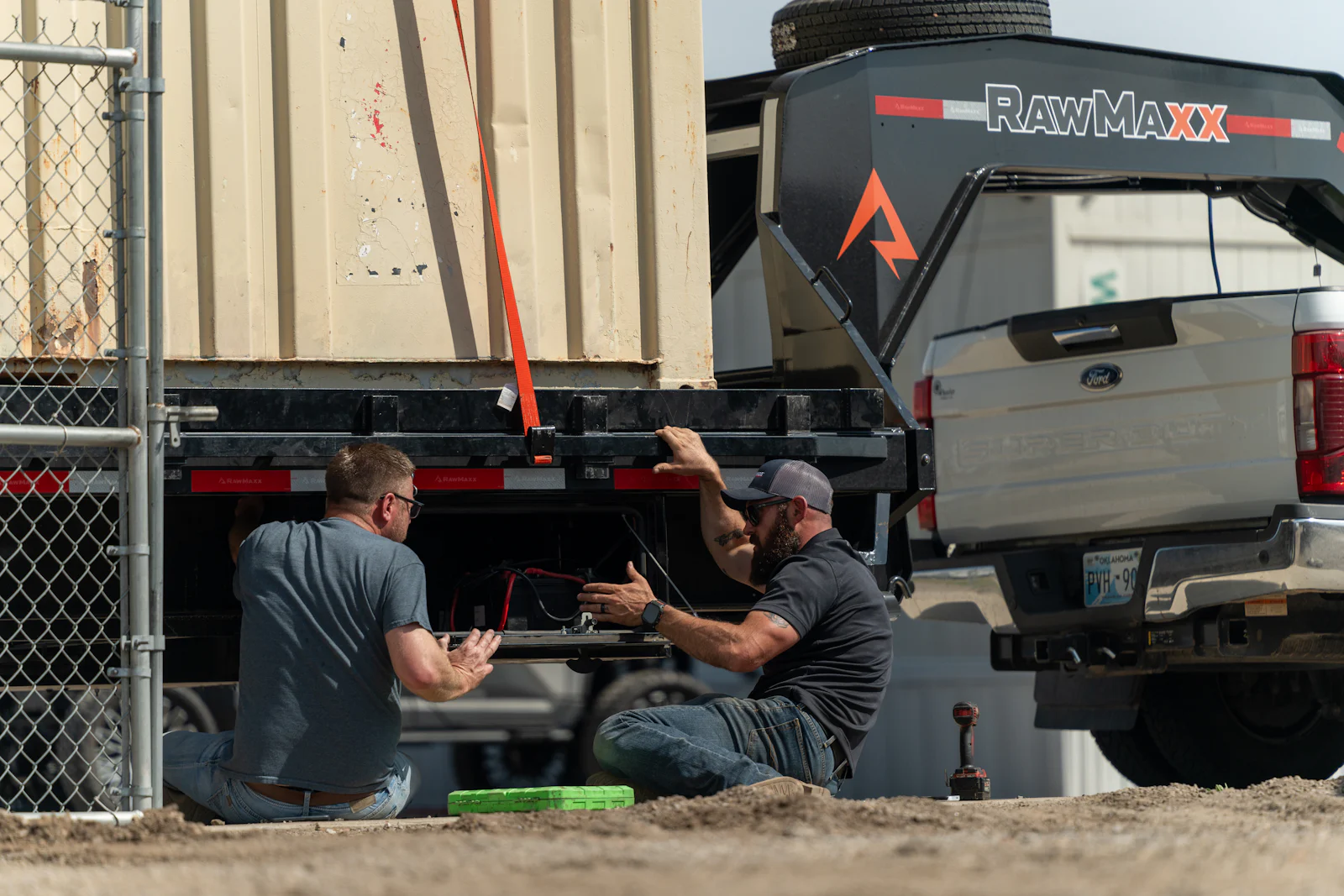 Oklahoma City team securing a load on a flatbed trailer