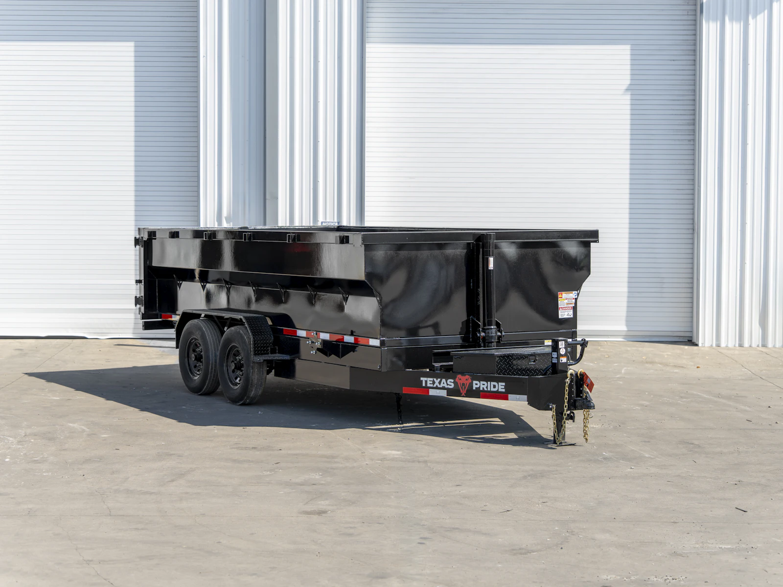 Texas Pride 16'x83" Bumper Pull Dump Trailer w/ 36" Sides, front three-quarter view Texas Pride 16'x83" Bumper Pull Dump Trailer w/ 36" Sides, front three-quarter view