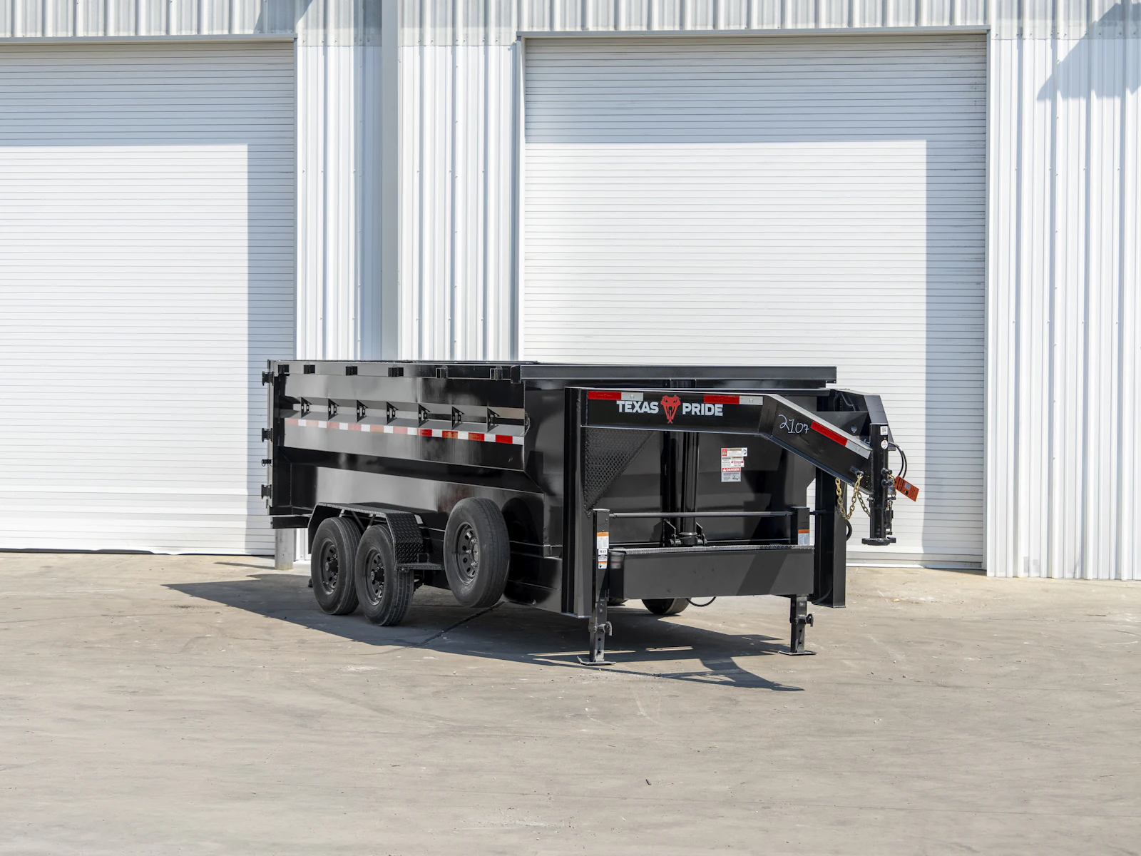 Texas Pride 16'x83" Gooseneck Dump Trailer w/ 48" Sides, front three-quarter view Texas Pride 16'x83" Gooseneck Dump Trailer w/ 48" Sides, front three-quarter view