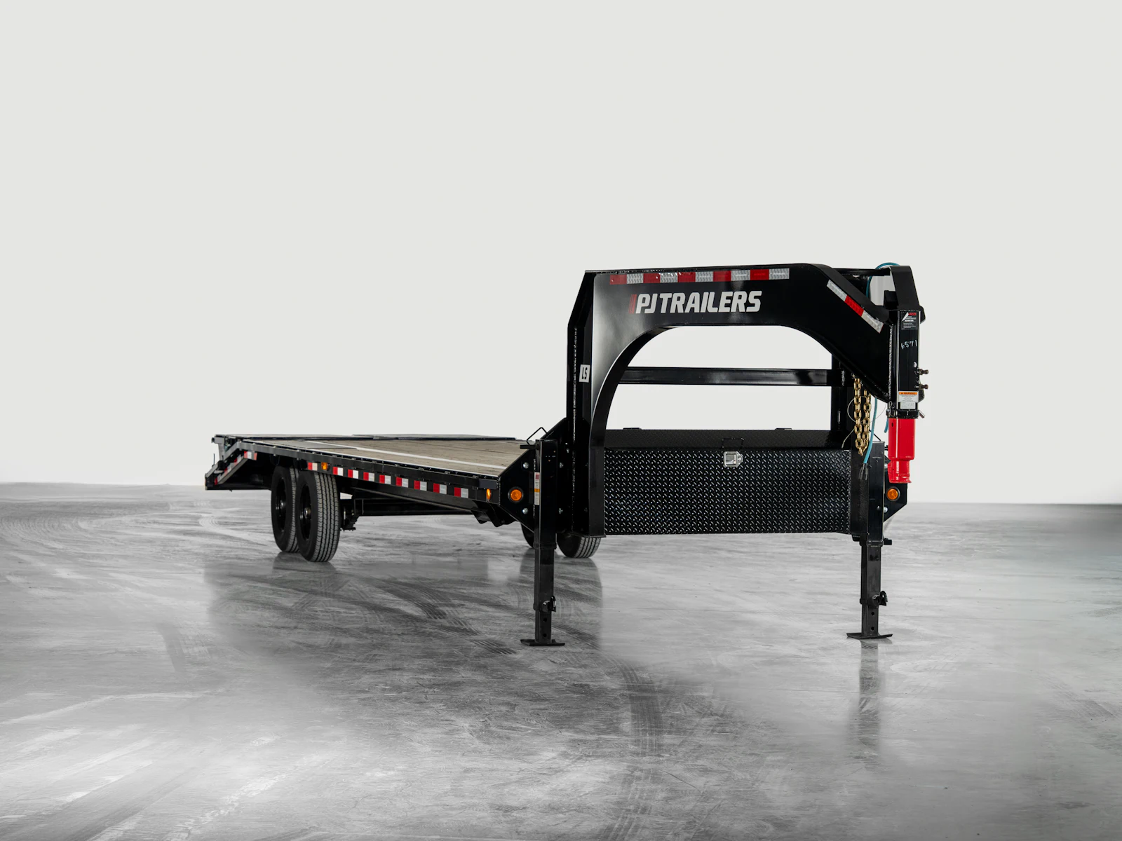 PJ Trailers Low-Pro Flatdeck With 7K Singles, studio view 1