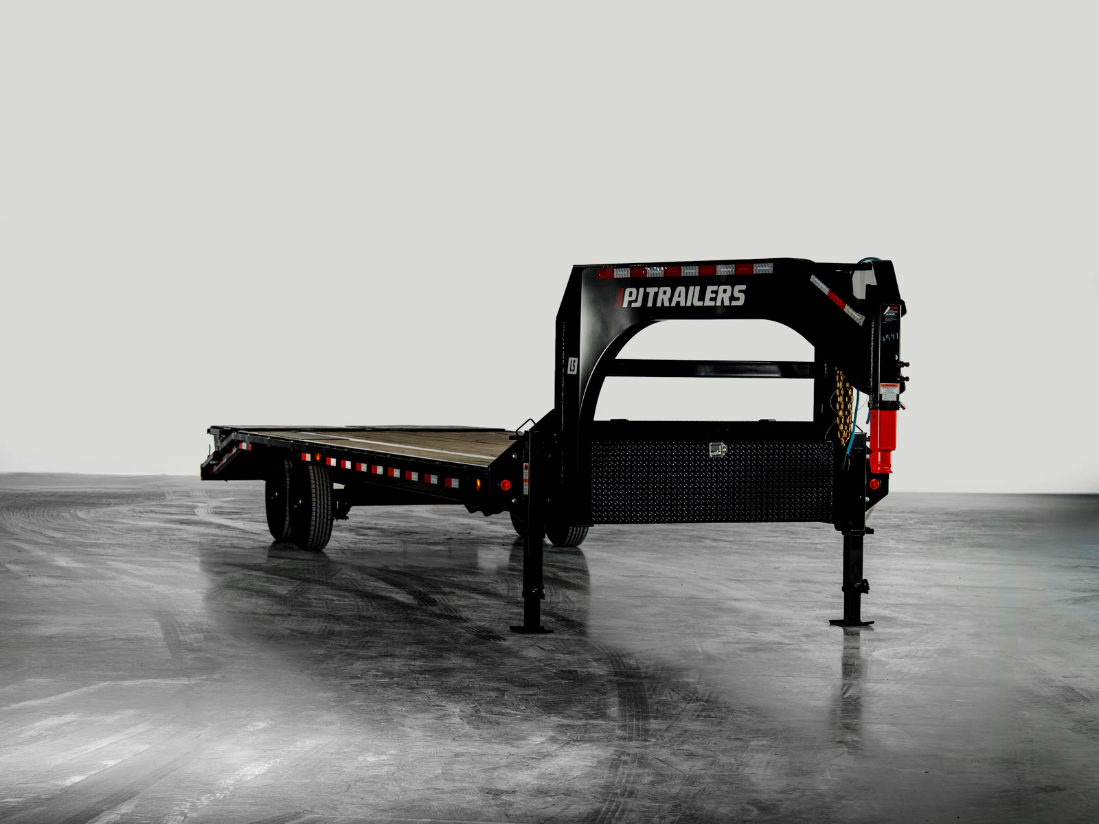 PJ Trailers Low-Pro Flatdeck With 7K Singles, studio view 1