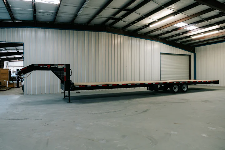 Texas Pride 40-foot straight-deck gooseneck flatbed, full driver-side view