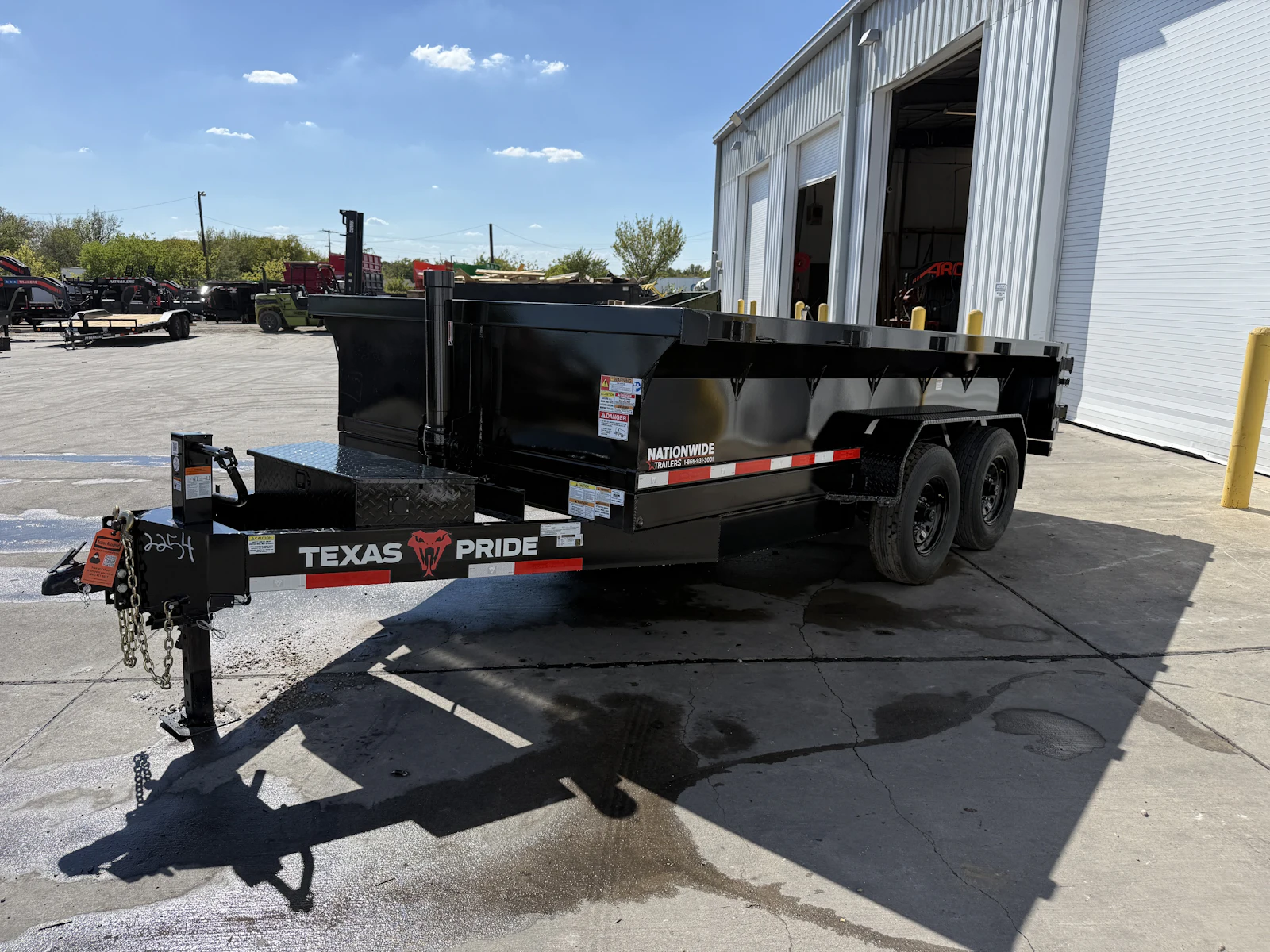Texas Pride 14'x83" Bumper Pull Dump Trailer w/ 24" Sides, front three-quarter view