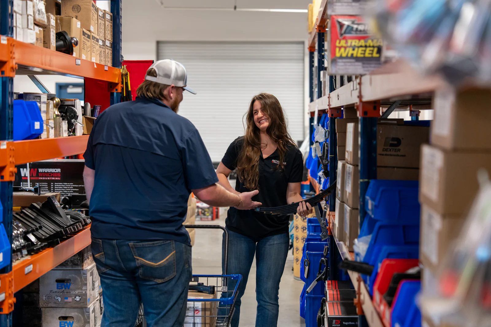 Parts specialist helping a customer in the Fort Worth parts aisle