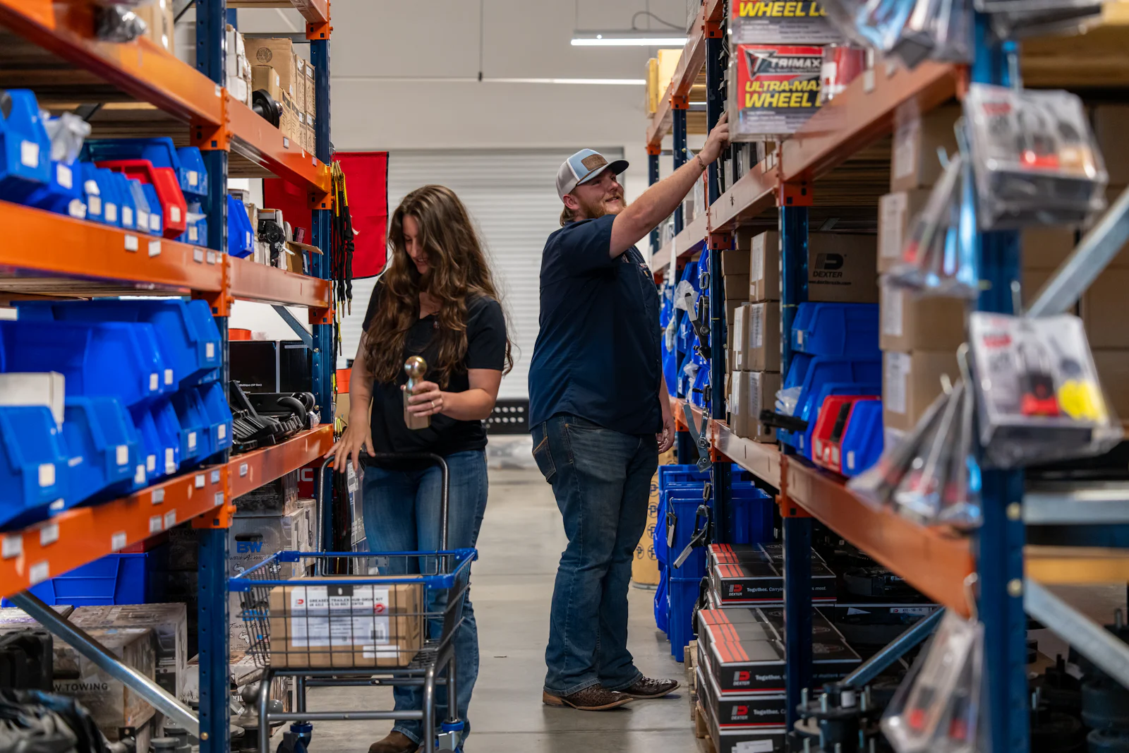 Customers shopping stocked trailer parts aisles at Nationwide Trailers